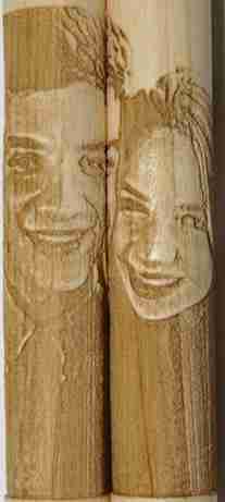 Close up image of photo-engraved drumstick set showing two people side by side