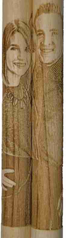 Vertically engraved drumstick set showing couple side by side and smiling