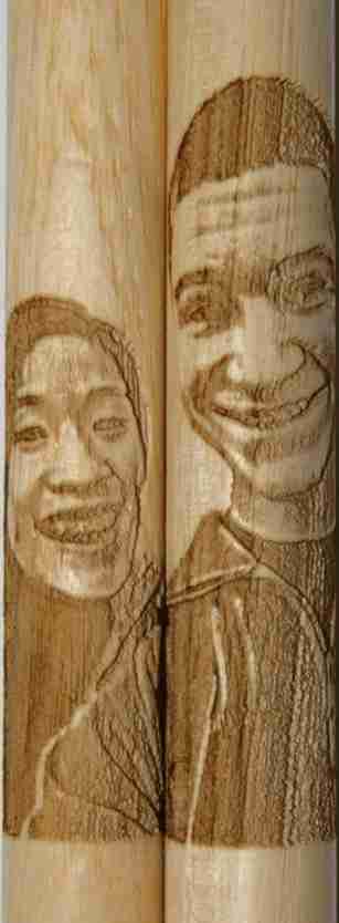 Custom drumstick set where both people are close together in starting image.